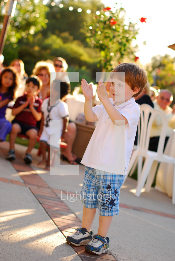 toddler boy clapping his hands