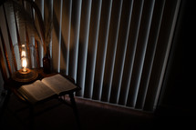 lantern and Bible in a chair 