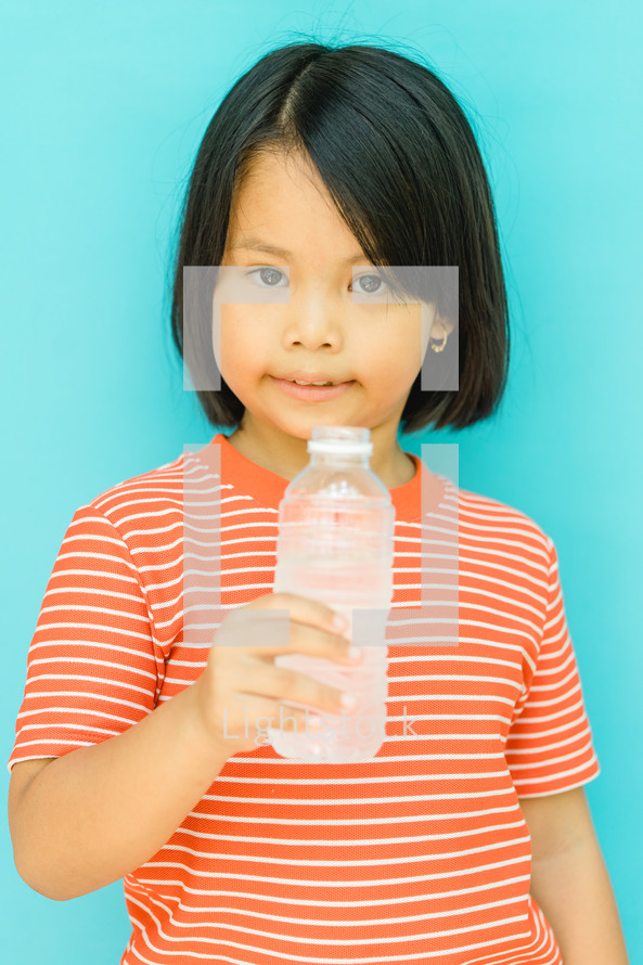 girl holding a water bottle 