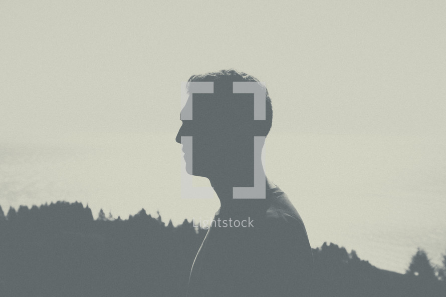 silhouette of a man's side profile. 