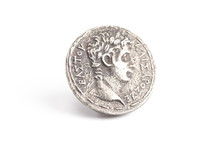 An Ancient Silver Roman Coin Replica Isolated on a White Background