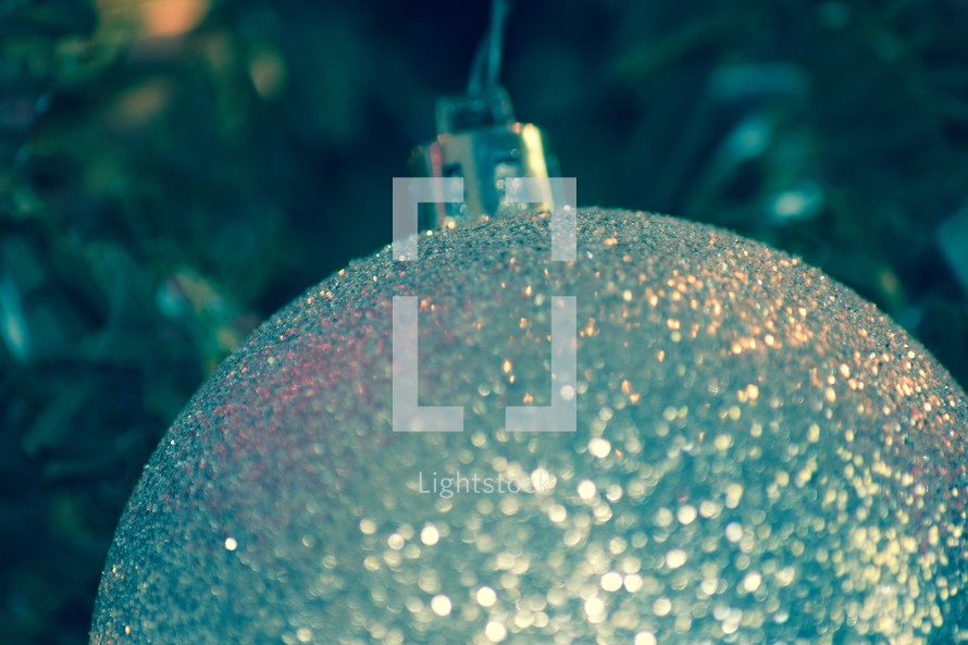 a silver glittery Christmas ornament 