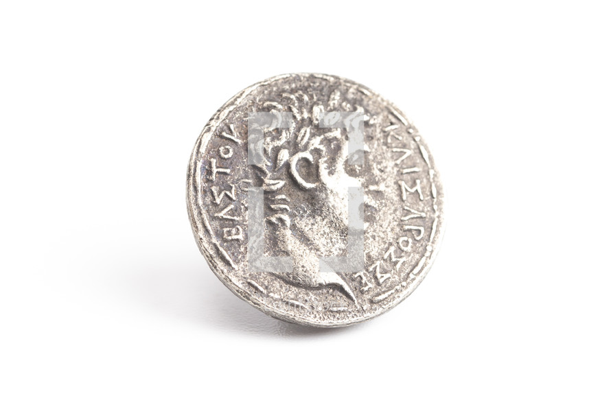An Ancient Silver Roman Coin Replica Isolated on a White Background