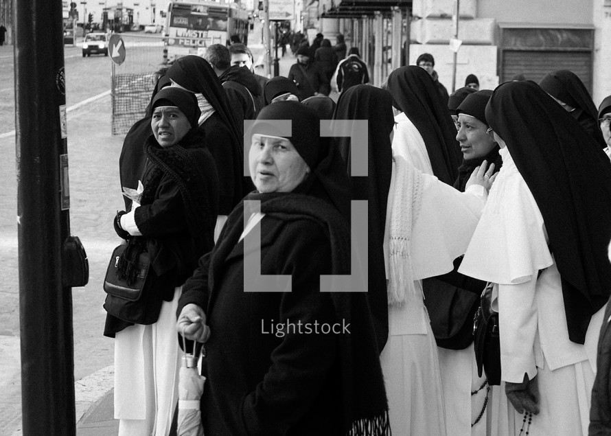 nuns walking down a street in Rome 
