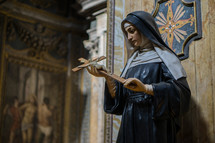 statue of Mary holding a crucifix 