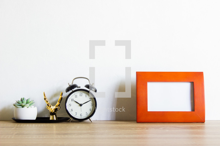 alarm clock and blank frame 