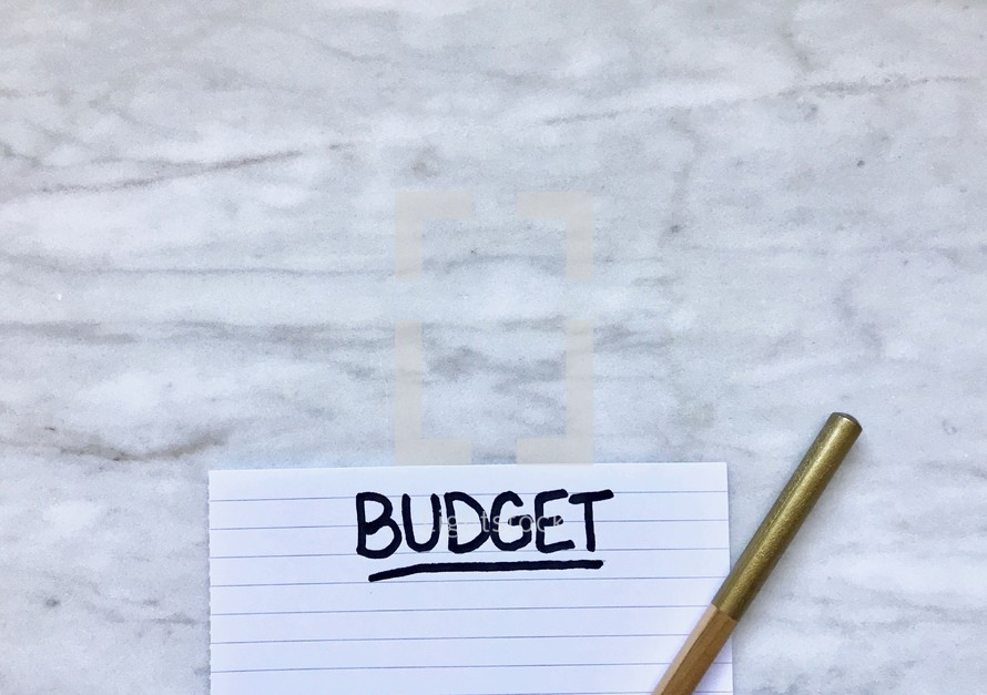 budget on a notepad and pencil 