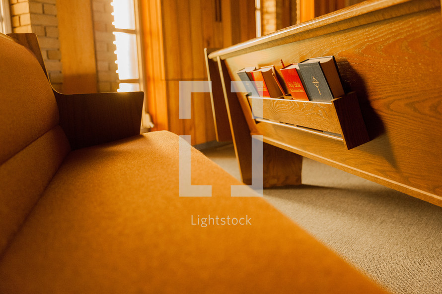 Bibles and hymnals in the back of pews 