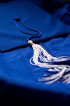 blue graduation cap and gown 
