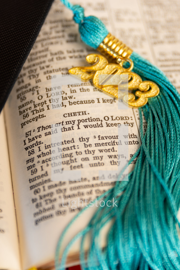 a 2023 graduation tassel on a open Bible
