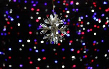 snowflake ornament and red, white, and blue lights 