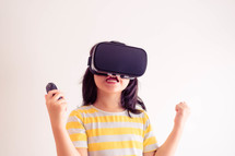 a child wearing VR goggles 