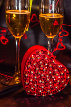 champagne glasses and heart shaped gift box