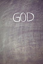 GOD written on a chalkboard