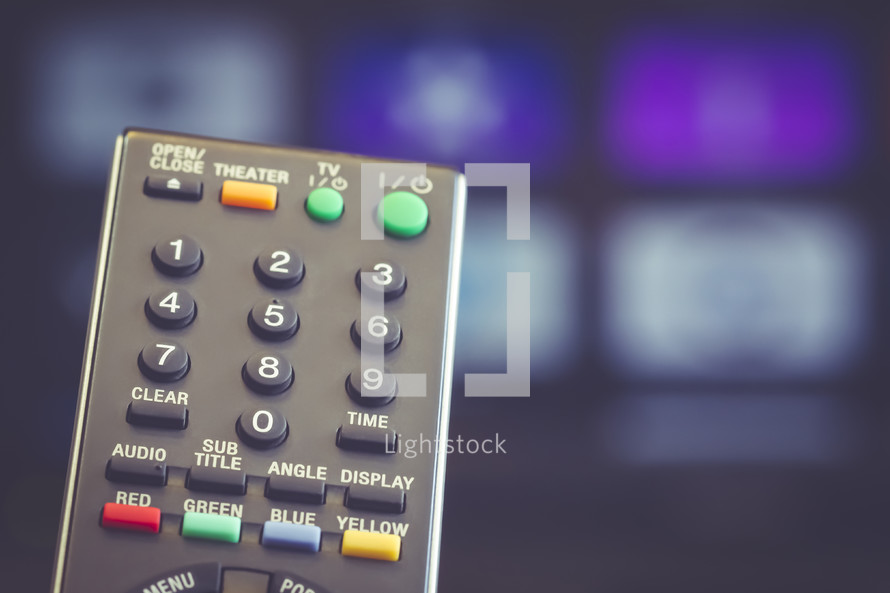 a remote control in front of a smart tv