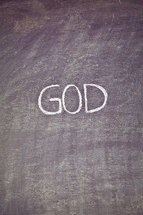 GOD written on a chalkboard
