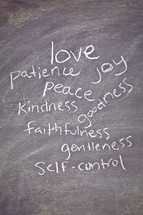 The Fruit of the Spirit - love, patience, joy, peace, kindness, faithfulness, goodness, gentleness, and self-control written on a chalkboard