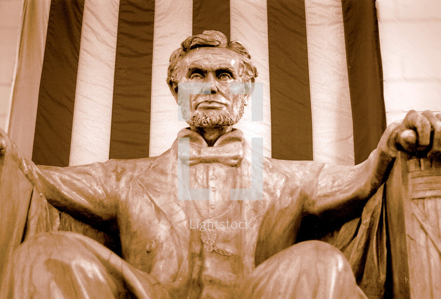 Abraham Lincoln sitting in the Lincoln Memorial with the US flag draped behind him in this sepia tone image. Ideal for Presidents Day photos or anything surrounding American History, The Civil War, War between the states, or the American Presidency. 
