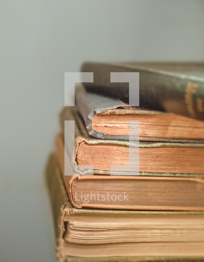 Stack of old books on a light background