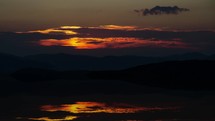 Sunrise over mountains lake landscape Time lapse
