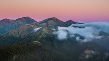 Colorful sunrise over mystic alpine mountains in New Zealand wild nature time-lapse
