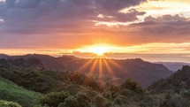 Beautiful sunrise over wild forest mountains in summer morning in New Zealand nature Time-lapse

