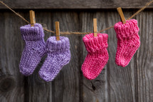 two pairs of knit baby socks