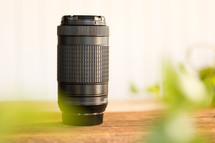a camera lens on a table with a white background