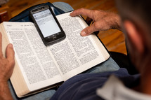 personal Bible study, man, with Bible and smartphone 