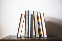 row of books on a table 