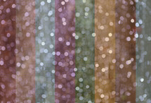 a striped background of bokeh lights with colors and tones added in photoshop