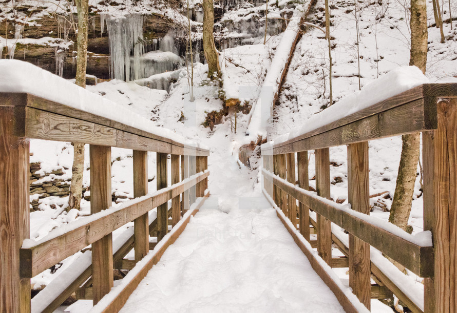 snow on a wooden footbridge 
