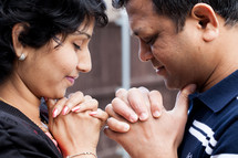 An Indian couple in prayer together 