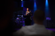 a female pastor leading a worship service 