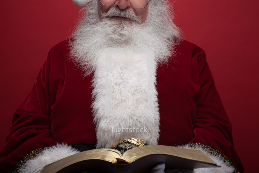 Santa reading a Bible 
