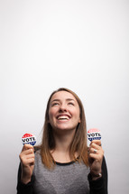young woman and vote election day buttons 