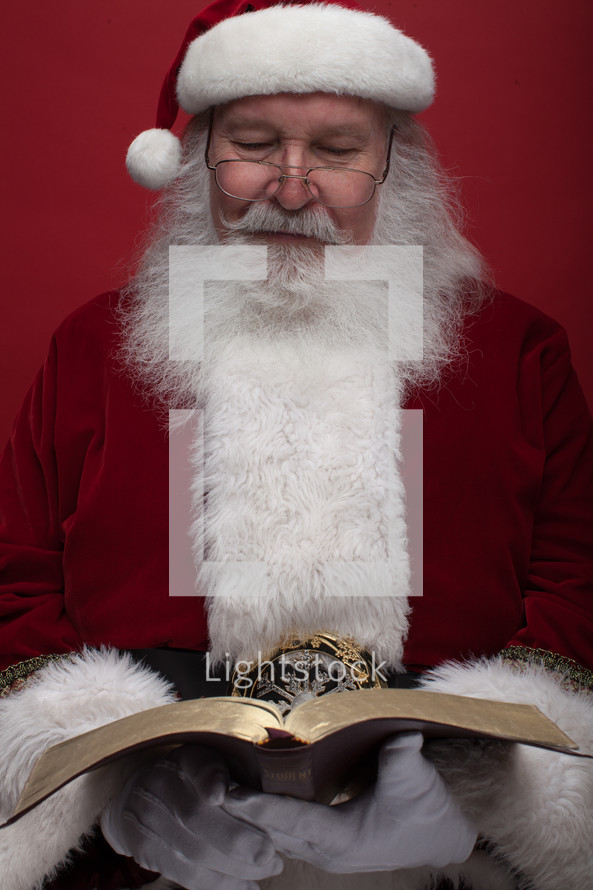Santa reading a Bible 