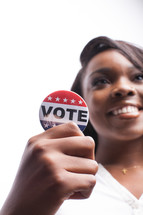young woman and a vote button 
