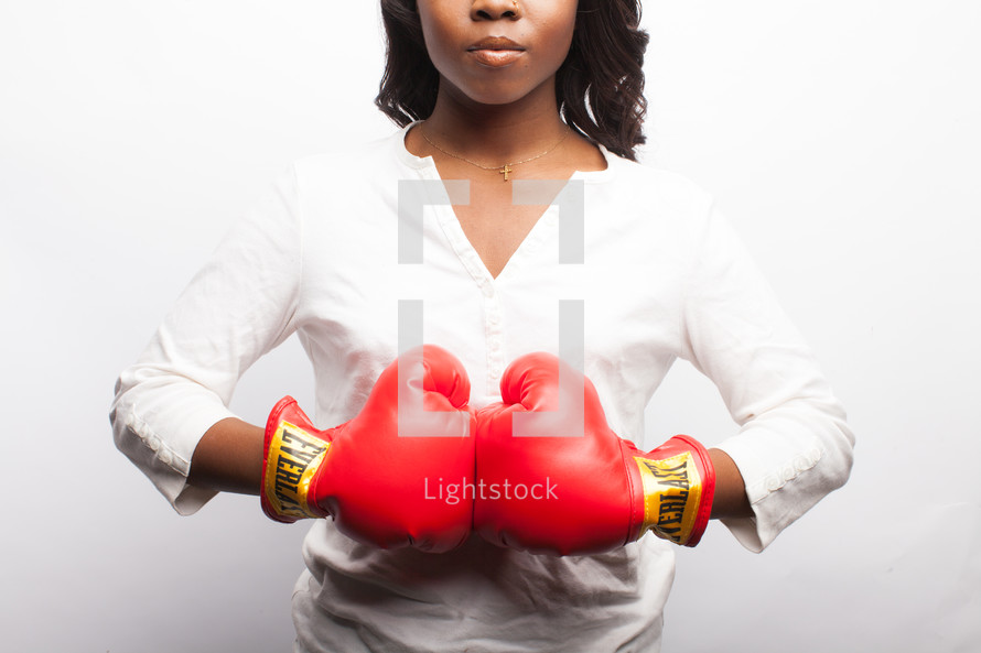 young woman in red boxing gloves 