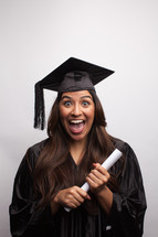 smiling graduate holding a diploma 