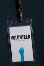 A plastic badge for a volunteer.