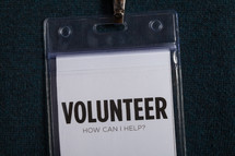 Plastic badge holder and clip for a volunteer.