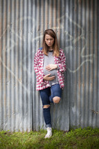 teen girl holding her pregnant belly 