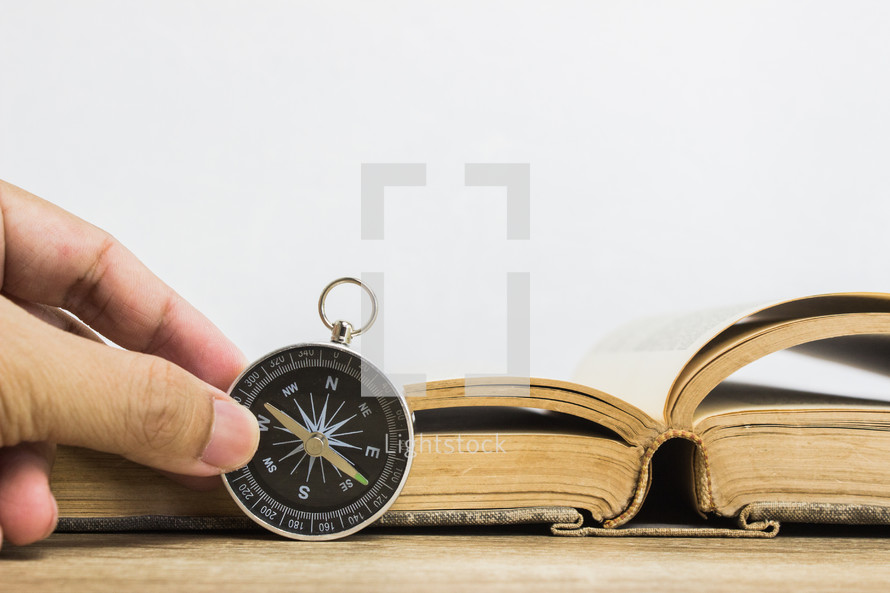 open book and compass 