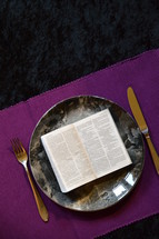 bible opened up at Matthew 4:4  on a plate