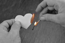 matches and a burnt heart shaped peice of paper 