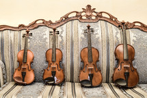 violins on a couch 