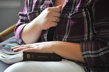 a young woman reading a Bible 