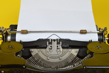 typewriter with blank paper 