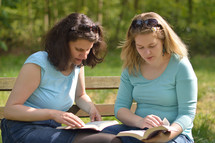 Bible study with friends outside on a sunny day. 